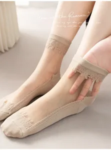 Detailed view of women's sheer lace crystal silk ankle socks with elegant floral patterns.