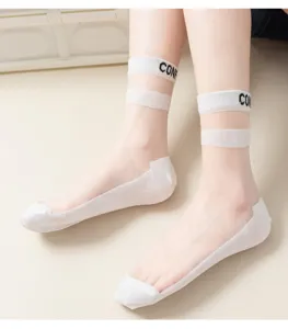 Sheer crystal silk short socks detail view showing double stripe ankle cuff and cotton sole.
