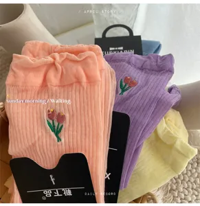 Cute tulip embroidered ruffle mid-tube socks for women, sweet Japanese style daily wear.