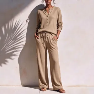 Women waffle knit lounge set featuring a long sleeve button henley top and wide leg pants.