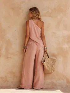 Details shot of the pink linen cotton one shoulder sleeveless top and wide leg pants set.