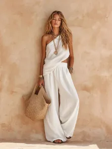 Detailed view of the casual linen one-shoulder top and wide-leg trousers, stylish.