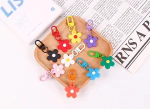 Schattige snoepkleur bloem sleutelhanger detail, stijlvolle hars bloemen tas hanger accessoire.