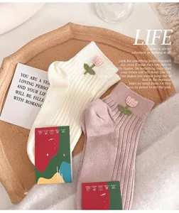 Cute tulip embroidered short socks detail shot, soft cotton breathable ankle socks pair.