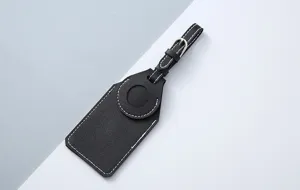 Black PU leather luggage tag protective holder, custom designed for Apple AirTag tracking device.