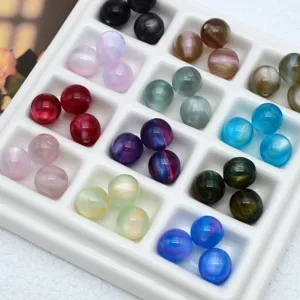 Colorful jelly cat eye beads close up display in white sorting tray for DIY handmade jewelry.
