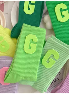 Green ribbed collegiate style women socks with letter G patch, trendy casual daily wear hosiery
