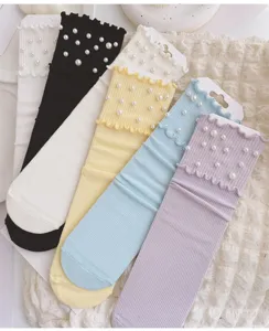 Detailed view of women's candy color ruffle socks with elegant pearl decor in multiple shades.