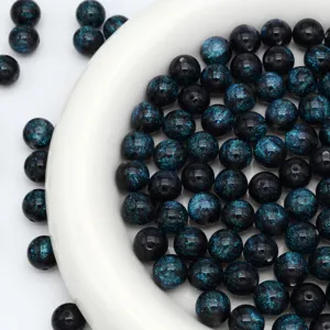Close-up of starry glitter round beads, blue shimmering mermaid beads for DIY bracelet accessories.