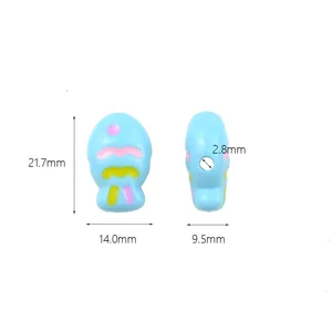 Acrylic painted fish bead detail view, multi-color charm component with center hole, close up