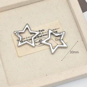 Metal star snap hook detail close-up, silver alloy clasp for DIY bag keychain accessories.