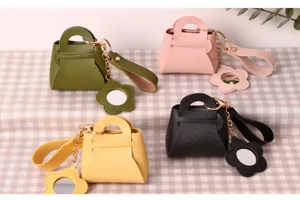 Mini PU leather handbag keychain with cute flower mirror pendant, stylish coin purse charm.