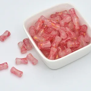 Pink bamboo-shaped glass beads with gold speckles, perfect for handmade DIY jewelry bracelets making.