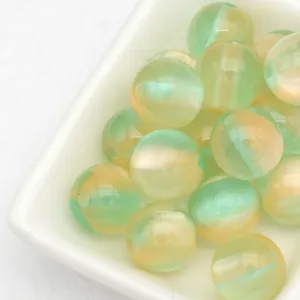 Gros plan de perles œil de chat gelée de rêve 12 mm, perles en vrac brillantes pour bracelets.