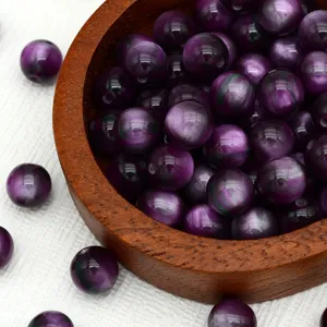 Purple cat eye loose beads detail shot, ideal for DIY handmade jewelry and craft accessories.