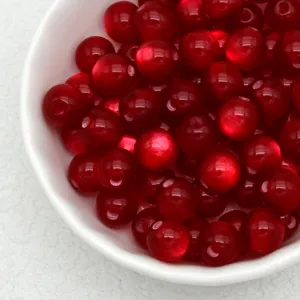 Red jelly resin cat-eye effect loose beads for DIY handmade bracelets and vintage accessories.