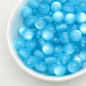 Light blue cat's eye resin beads detail, perfect for DIY handmade bracelets and antique jewelry.