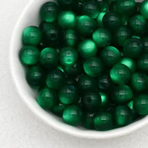 Green jelly cat eye resin beads close-up, perfect for DIY handmade bracelets jewelry making.