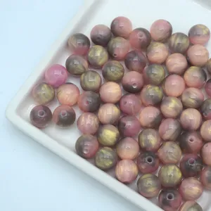 Pink and gold swirled resin loose beads ideal for DIY handmade bracelets and phone accessories.