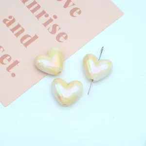 Acrylic UV electroplated heart beads detail shot for handmade DIY jewelry making and crafts.