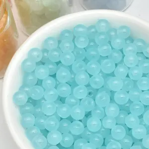 Detailed view of 4mm light blue cat-eye glass loose beads for handmade DIY jewelry making.