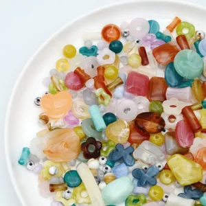 Acrylic mixed beads detail shot, colorful handmade DIY bracelet and phone chain craft materials.