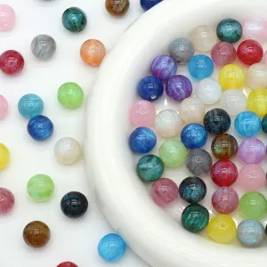 Detailed view of colorful starry mermaid resin round beads, perfect for DIY jewelry making.