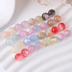 Close-up detail of glittering resin round beads for DIY handmade jewelry bracelets.