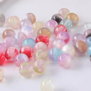 Close up detail of colorful glitter resin round beads for DIY handmade jewelry accessories.