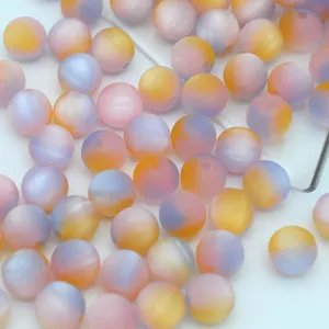 Close-up details of frosted resin beads, beautiful oil painting gradient colors for DIY crafts.