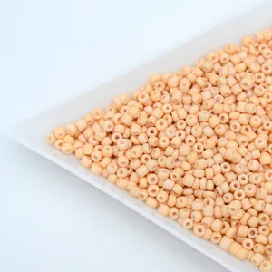 Small pastel peach glass seed beads for DIY jewelry making, bracelets, and handmade crafts.