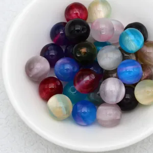 Colorful jelly cat eye loose beads detail shot, translucent round DIY jewelry accessories.