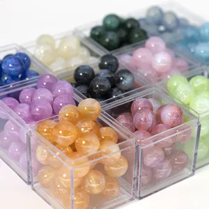 Close-up details of starry mermaid fine glitter resin round beads acrylic loose beads.