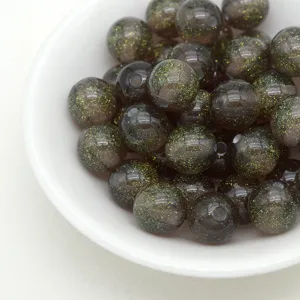 Resin jelly beads close-up, starry glitter round beads for DIY bracelet jewelry making craft parts.