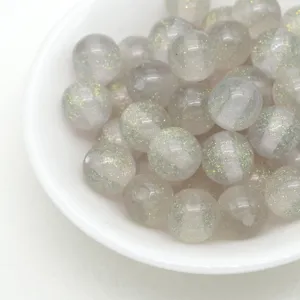Detailed view of sparkling jelly resin round beads with glitter for DIY bracelets and charms.