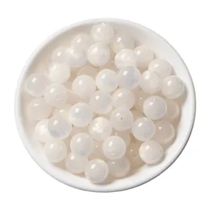 White resin cat eye round beads mixed for DIY handmade jewelry making and craft accessories.