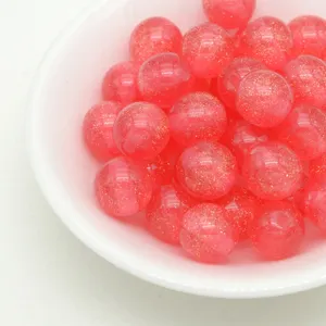 Pink glitter resin beads detail shot, sparkling jelly round beads for handmade DIY jewelry.