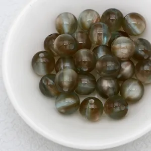 Close-up of dreamy jelly cat eye beads, perfect for DIY jewelry making and bracelets.