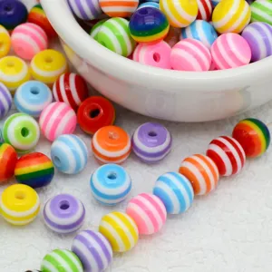 Colorful striped resin beads close up, DIY craft supplies for handmade jewelry making