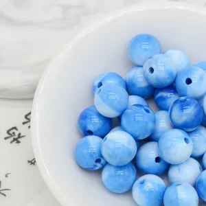 Blue marble acrylic beads detail showing smooth glossy surface for DIY jewelry making.