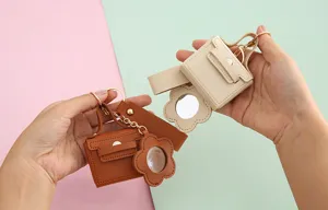 Mini PU lederen tas sleutelhanger met bloemspiegel, schattige draagbare hanger voor sleutels en tassen.