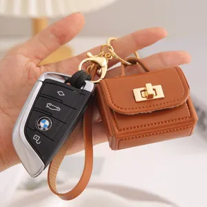 Mini bolso de cuero PU llavero monedero bolsa de almacenamiento de auriculares portátil.