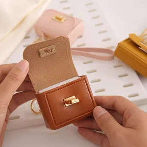 Llavero mini monedero de piel PU, bonita bolsa de almacenamiento portátil para auriculares.