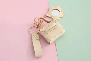 PU lederen mini handtas sleutelhanger met bloemspiegel, schattig accessoire voor tassen.