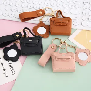 Mini lederen handtas sleutelhanger met spiegel, schattige tas hanger en oortjes etui voor vrouwen.