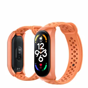 Detailed view of breathable silicone replacement watch strap in vibrant orange color finish.