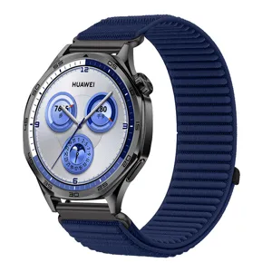 Detailed view of the blue woven nylon smartwatch strap with premium metal buckle texture.