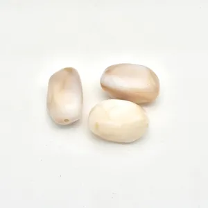 Close-up view of irregular marbled acrylic beads, showing smooth surface details for DIY.