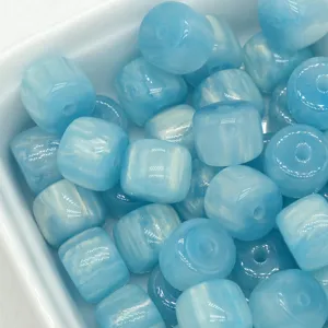 Light blue resin barrel loose beads detail, perfect for DIY jewelry making and clothing accessories.