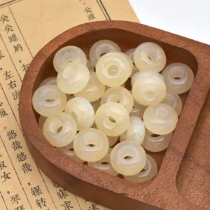 Detail view of sparkly resin beads in wooden tray, great for your DIY craft and bag accessories.